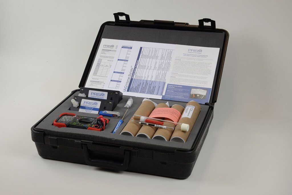 Open black case containing indoor air quality testing equipment.